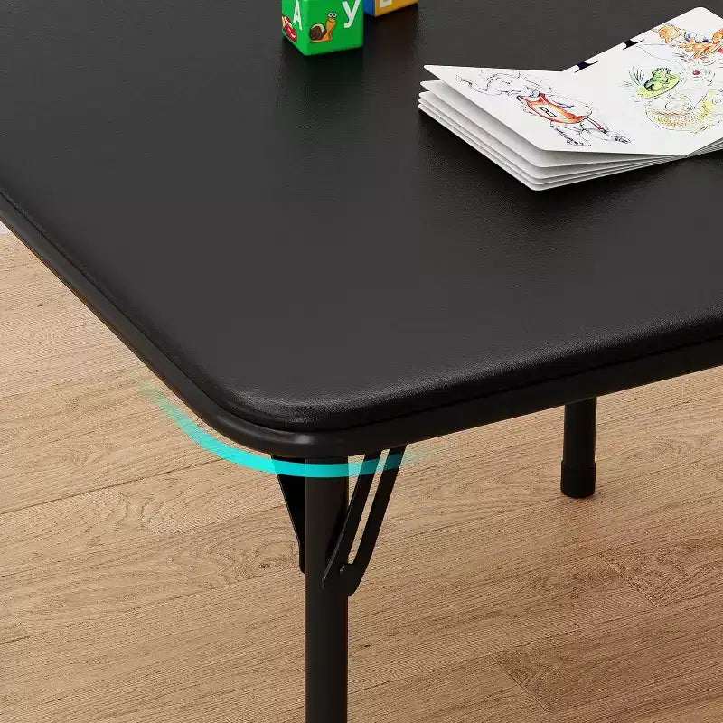 Ensemble table et deux chaises pliantes pour enfants, avec coussins en PU, facile à ranger, idéal pour les repas, la lecture et les jeux des enfants.