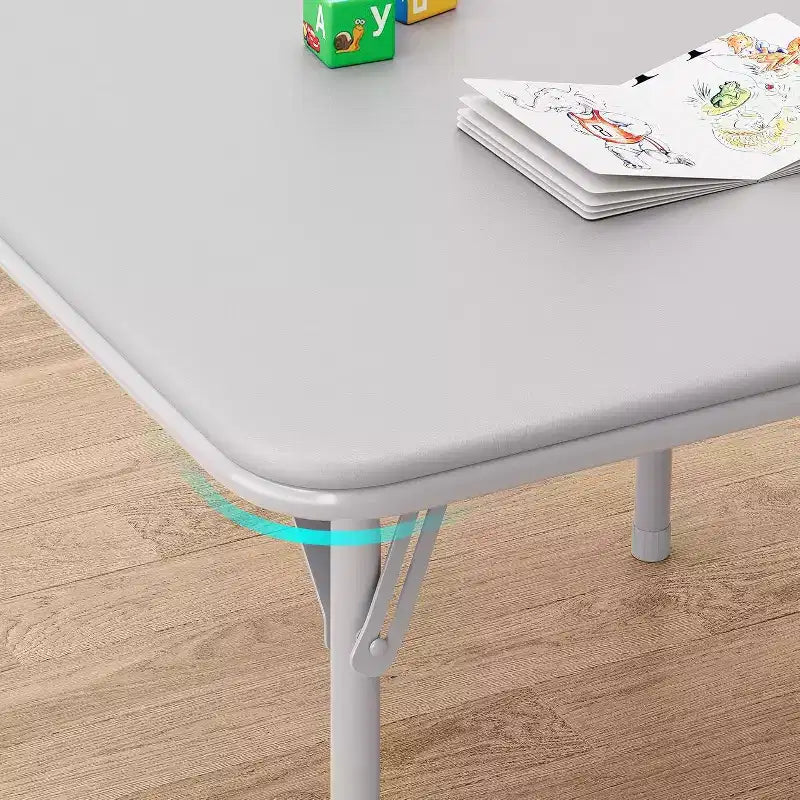 Ensemble table et deux chaises pliantes pour enfants, avec coussins en PU, facile à ranger, idéal pour les repas, la lecture et les jeux des enfants.