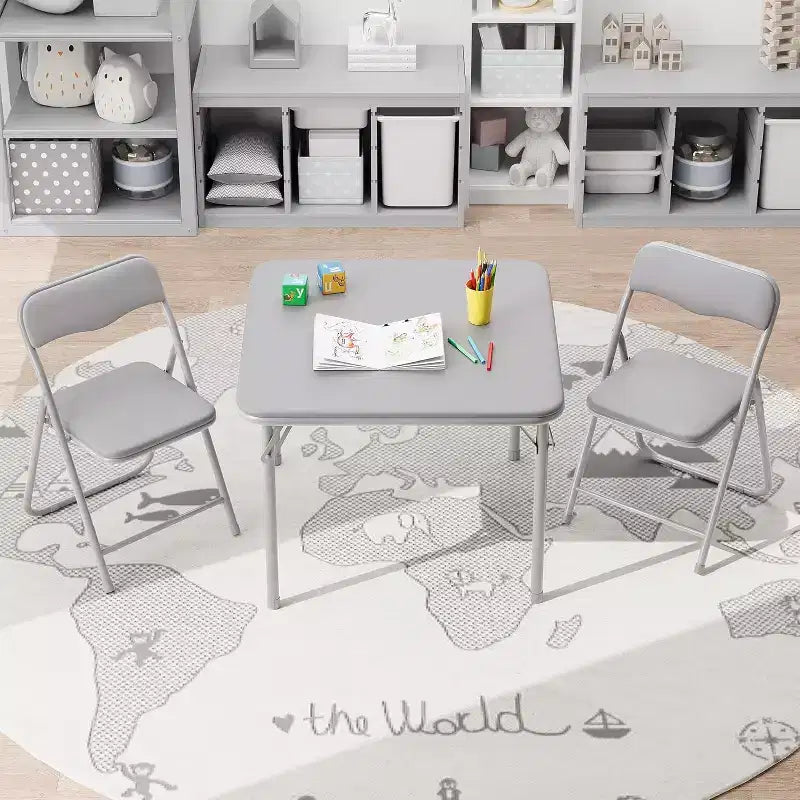 Ensemble table et deux chaises pliantes pour enfants, avec coussins en PU, facile à ranger, idéal pour les repas, la lecture et les jeux des enfants.