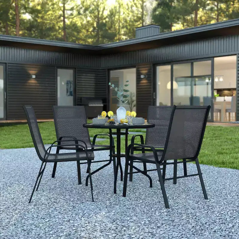 Emma et Oliver Ensemble de salle à manger de jardin cinq pièces avec table ronde en métal avec plateau en verre trempé et 4 chaises empilables Flex Comfort
