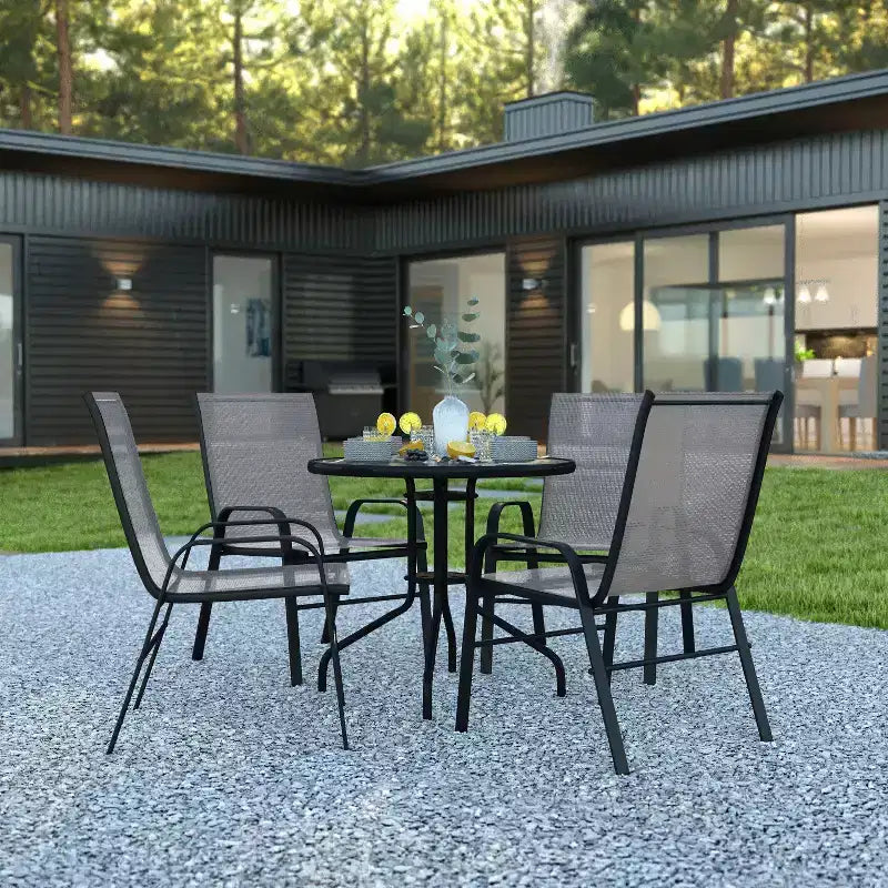 Emma et Oliver Ensemble de salle à manger de jardin cinq pièces avec table ronde en métal avec plateau en verre trempé et 4 chaises empilables Flex Comfort